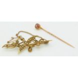 Victorian stick pin set with topaz and an Edwardian 9ct brooch in the form of a swallow set with