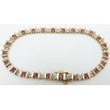 A 9ct gold bracelet set with rubies and diamonds, 9.5g