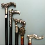 Five walking sticks with various ornamental handles