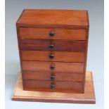 An apprentice / collector's chest of six straight drawers, W23 x D12 x H28cm
