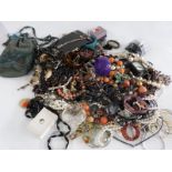 A collection of costume jewellery including two silver pendants, silver earrings, necklaces etc