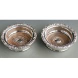 Pair of silver plated wine coasters with inset mahogany bases, diameter 15cm