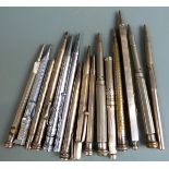 Fifteen white metal and silver plated pencils, some with hardstone finials.