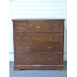 Secretaire chest of drawers with central drawer contatineing a bank of smaller drawers, flanked by