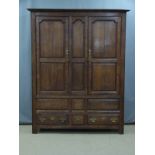 Antique oak panelled wardrobe with three drawer below, W148 x D54 x H196cm
