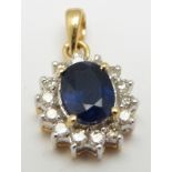 An 18ct gold pendant set with an oval cut sapphire measuring approximately 0.75ct surrounded by