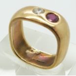 A 9ct gold ring set with a cubic zirconia and a ruby, 5.3g,