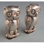 Novelty salt and pepper shakers, each formed as owls with hinged bases, height 5.5cm