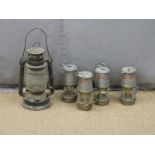 Four Wolf Safety Lamp Co. miner's or similar lamps and a hurricane lamp height excluding handle