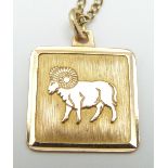 A 9ct gold pendant depicting a ram for Aries birth sign (1.3g) on a 14k gold chain (3.1g)