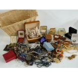 A collection of costume jewellery including amber beads, agate necklace, ivory beads, silver bangle,