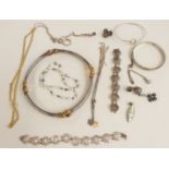 A collection of silver jewellery including a necklace with gilt sections, earrings, necklaces,