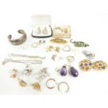 A collection of jewellery including Butler and Wilson brooch, silver bangle, pearl earrings,