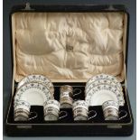 Cased set of George V hallmarked silver mounted Aynsley coffee cups and saucers, Birmingham 1924,