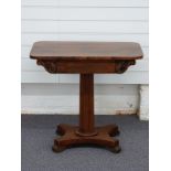 Victorian rosewood side table with octagonal column and pad feet