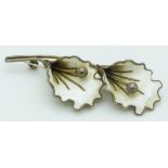 Norwegian silver brooch set with white enamel in the form of two flowers, length 7cm