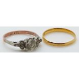 A 22ct gold ring/ wedding band and 9ct gold and silver ring set with paste