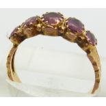 A 9ct gold ring set with garnets, 2.3g, size R