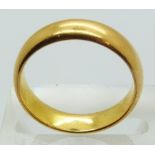 A 22ct gold wedding band, size N, 6.7g.