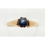 A yellow metal ring set with a sapphire, 1.3g, size J