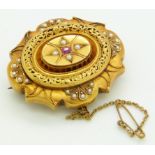 Victorian mourning brooch set with a ruby and seed pearls, with glass compartment verso, 4 x 3.5cm
