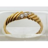 An 18ct gold ring set with five diamonds, Chester 1893, size O, 2.9g