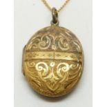 Victorian engraved locket on a 9ct gold chain, 3 x 2.5cm, 7.5g