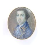 An early Victorian brooch set with a portrait miniature of a gentleman, 2.7 x 3.2cm