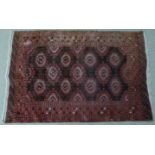 Turkoman kilim with 11 crimson central guls, within a border, 130 x 190cm