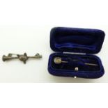 Victorian horseshoe stick pin in original box and silver brooch depicting a fox and horn, Birmingham