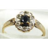A 9ct gold ring set with a sapphire and diamonds, 1.6g, size K
