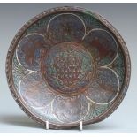 A 13thC French copper and polychrome champlevé enamel gemellion of typical shallow dished form,