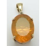 A 9ct gold pendant set with an oval mixed cut fire opal, 3.7g