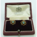 A pair of 9ct gold earrings set with a round cut zircon to each, in Asprey box