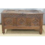 Antique oak coffer of carved panelled construction with peg joints, W131 x D58 x H70cm