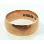 A 9ct rose gold wedding band, size T, 6.8g.