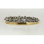 An 18ct gold ring set with eight diamonds, 3.1g, size Q