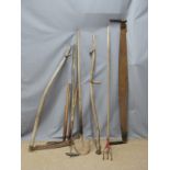 Collection of vintage farming/gardening tools including a scythe, two handled saw etc