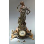 Early 20thC French figural clock in bronzed spelter finish depicting La Voix de la Lyre, signed