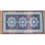 Retro 60's/70's kilim with deep blue ground and central star design, 127 x 67cm