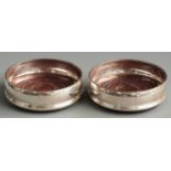 Pair of feature hallmarked silver wine coasters, London 1992 maker David R Mills, diameter 13cm