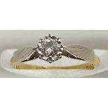 An 18ct gold ring set with a diamond in a platinum setting, 2.2g, size I