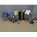 Seven various table and desk lamps including a pair with black columns
