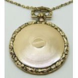 Victorian locket with engine turned decoration and foliate border (4cm diameter, 15g) and a yellow