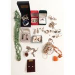 A collection of silver jewellery including charm bracelet, rings, earrings, necklaces, malachite and