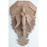 Nepalese/ Anglo Indian carved figural shelf bracket with fretwork decoration, the central figure the