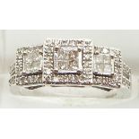 An 18ct white gold ring set with square cut and round cut diamonds, 3.7g, size L