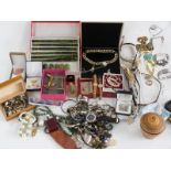 A collection of costume jewellery including necklaces, brooches, watches, a silver necklace set with
