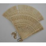 Two late 19thC/early 20thC Chinese pierced ivory fans, each approximately 17.5cm in length
