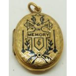 Victorian engraved locket with engraved decoration and black enamel script 'in memory', 3 x 2cm